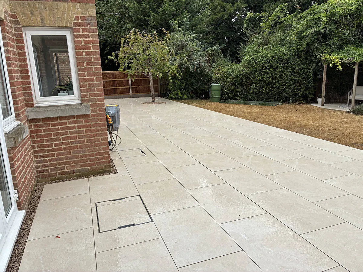Porcelain patio and Marshalls charcoal block paving driveway with granite gravel, installed by Pro Scapes Porcelain patio and Marshalls charcoal block paving driveway with granite gravel, installed by Pro Scapes