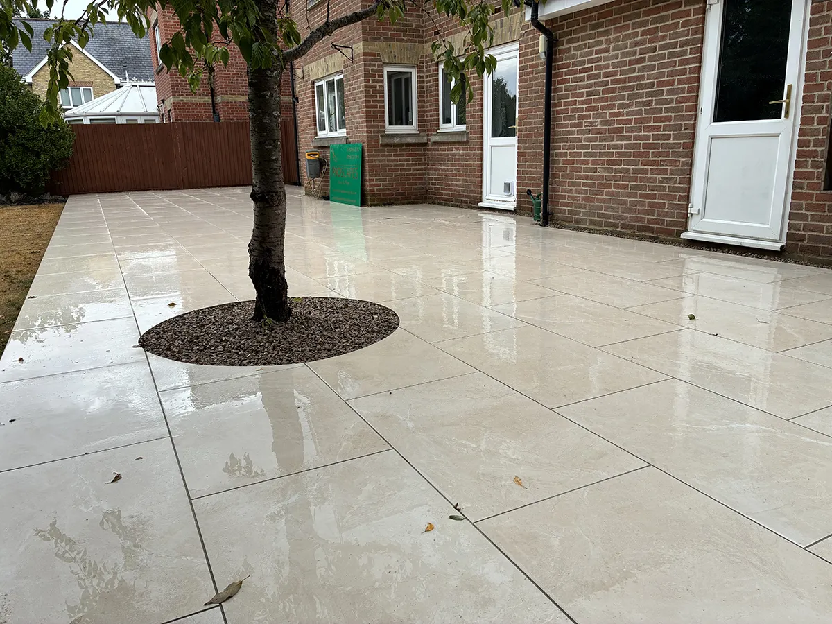 Porcelain patio and Marshalls charcoal block paving driveway with granite gravel, installed by Pro Scapes Porcelain patio and Marshalls charcoal block paving driveway with granite gravel, installed by Pro Scapes