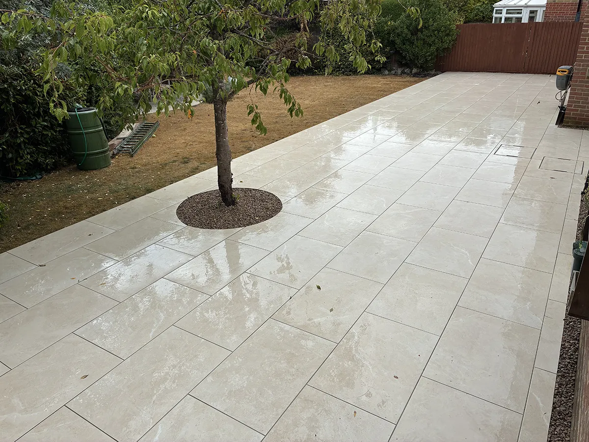 Porcelain patio and Marshalls charcoal block paving driveway with granite gravel, installed by Pro Scapes Porcelain patio and Marshalls charcoal block paving driveway with granite gravel, installed by Pro Scapes