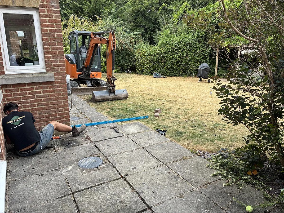 Porcelain patio and Marshalls charcoal block paving driveway with granite gravel, installed by Pro Scapes Porcelain patio and Marshalls charcoal block paving driveway with granite gravel, installed by Pro Scapes