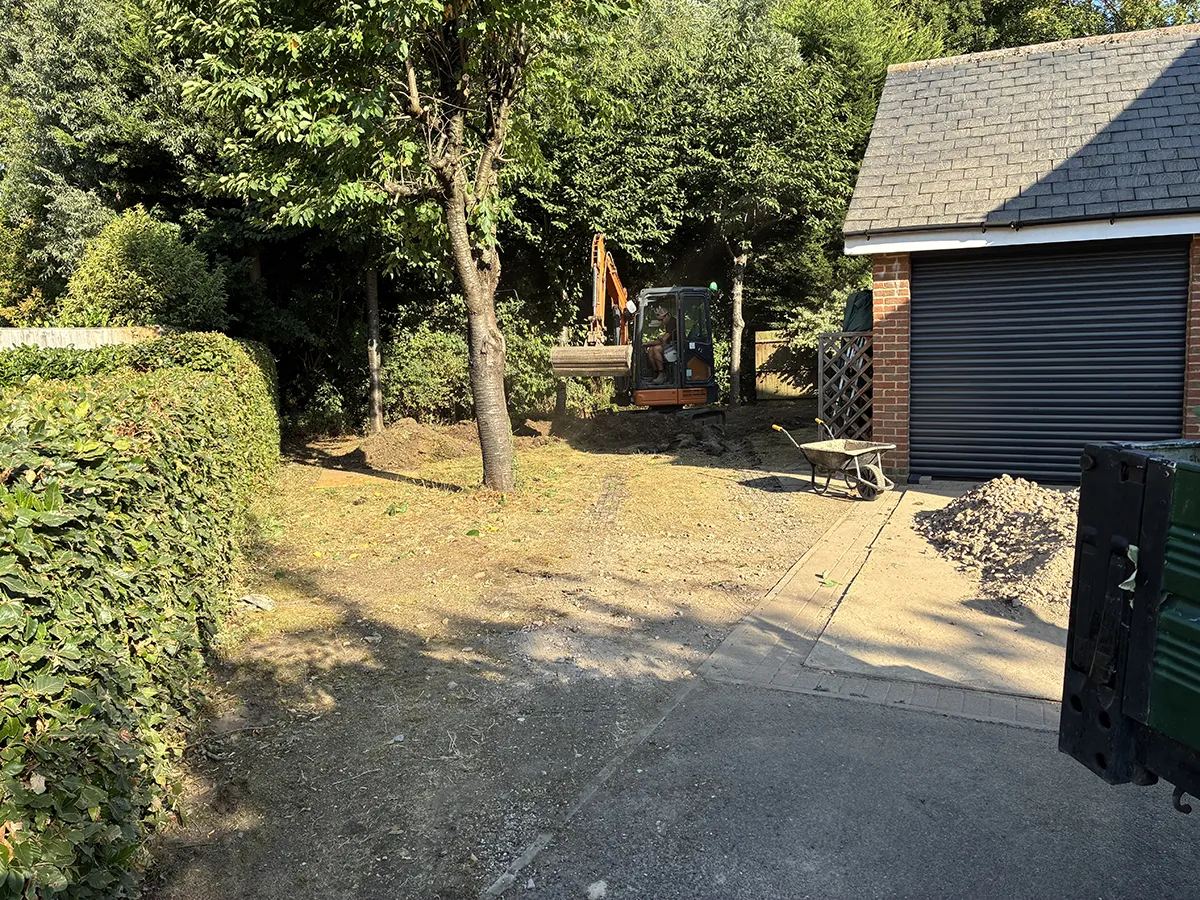Porcelain patio and Marshalls charcoal block paving driveway with granite gravel, installed by Pro Scapes Porcelain patio and Marshalls charcoal block paving driveway with granite gravel, installed by Pro Scapes