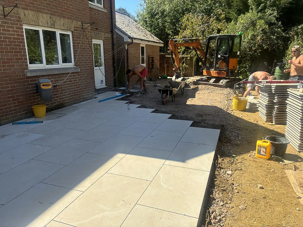 Porcelain patio and Marshalls charcoal block paving driveway with granite gravel, installed by Pro Scapes Porcelain patio and Marshalls charcoal block paving driveway with granite gravel, installed by Pro Scapes