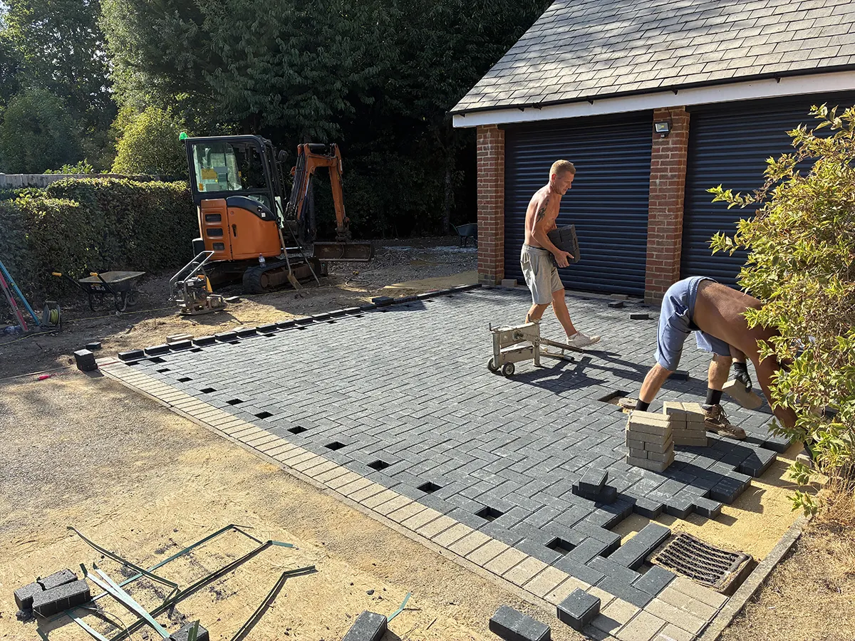 Porcelain patio and Marshalls charcoal block paving driveway with granite gravel, installed by Pro Scapes Porcelain patio and Marshalls charcoal block paving driveway with granite gravel, installed by Pro Scapes