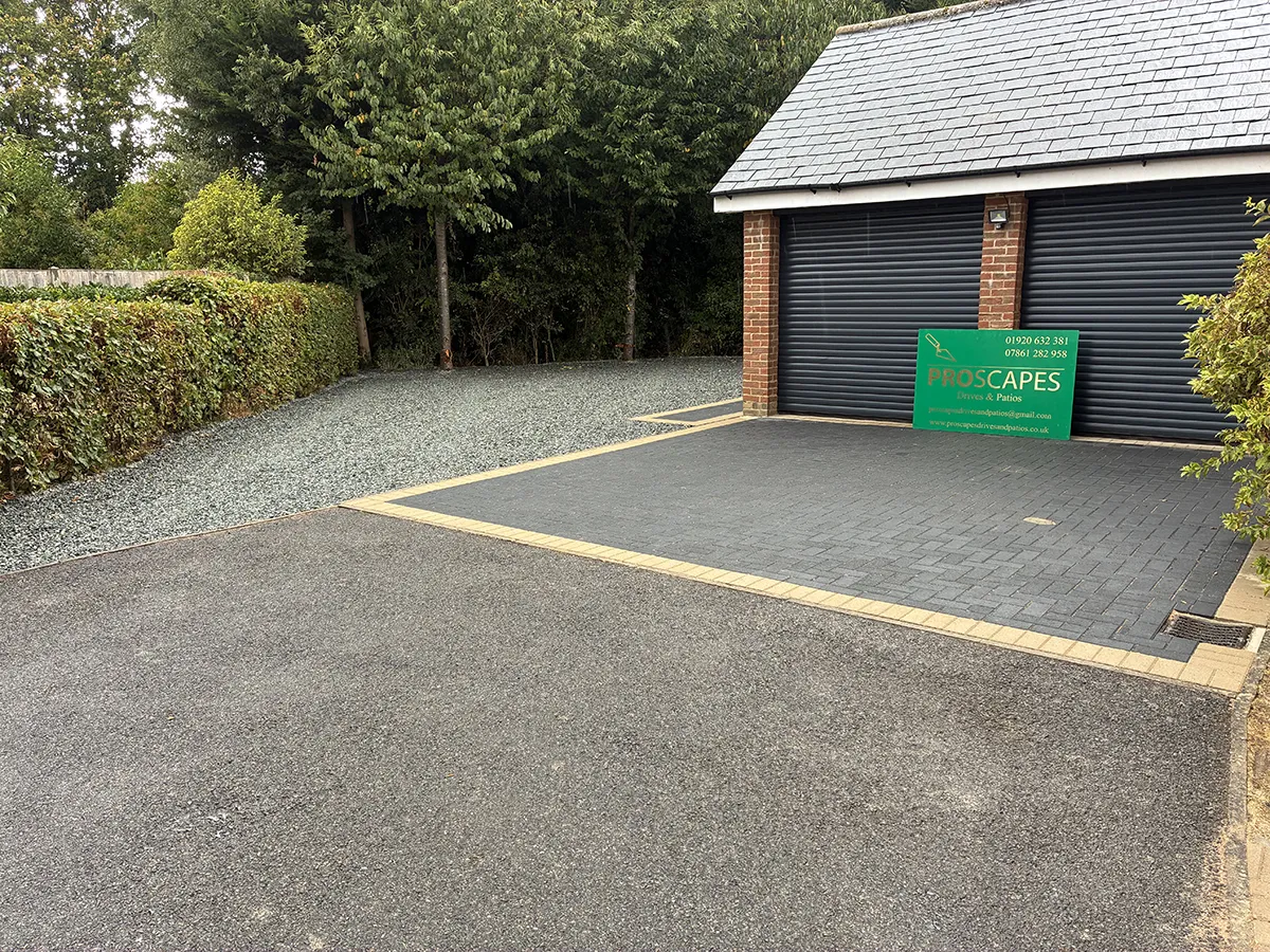 Porcelain patio and Marshalls charcoal block paving driveway with granite gravel, installed by Pro Scapes Porcelain patio and Marshalls charcoal block paving driveway with granite gravel, installed by Pro Scapes
