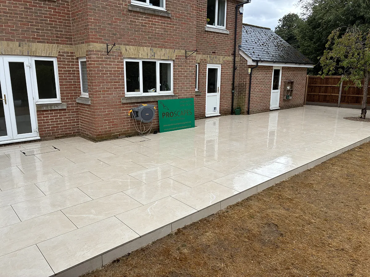 Porcelain patio and Marshalls charcoal block paving driveway with granite gravel, installed by Pro Scapes Porcelain patio and Marshalls charcoal block paving driveway with granite gravel, installed by Pro Scapes