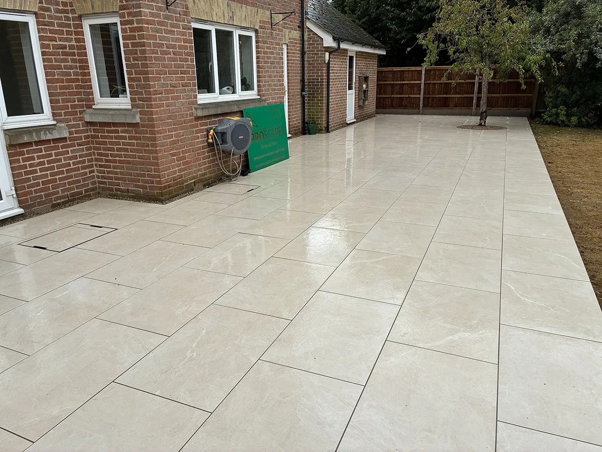 Porcelain patio and Marshalls charcoal block paving driveway with granite gravel, installed by Pro Scapes Porcelain patio and Marshalls charcoal block paving driveway with granite gravel, installed by Pro Scapes
